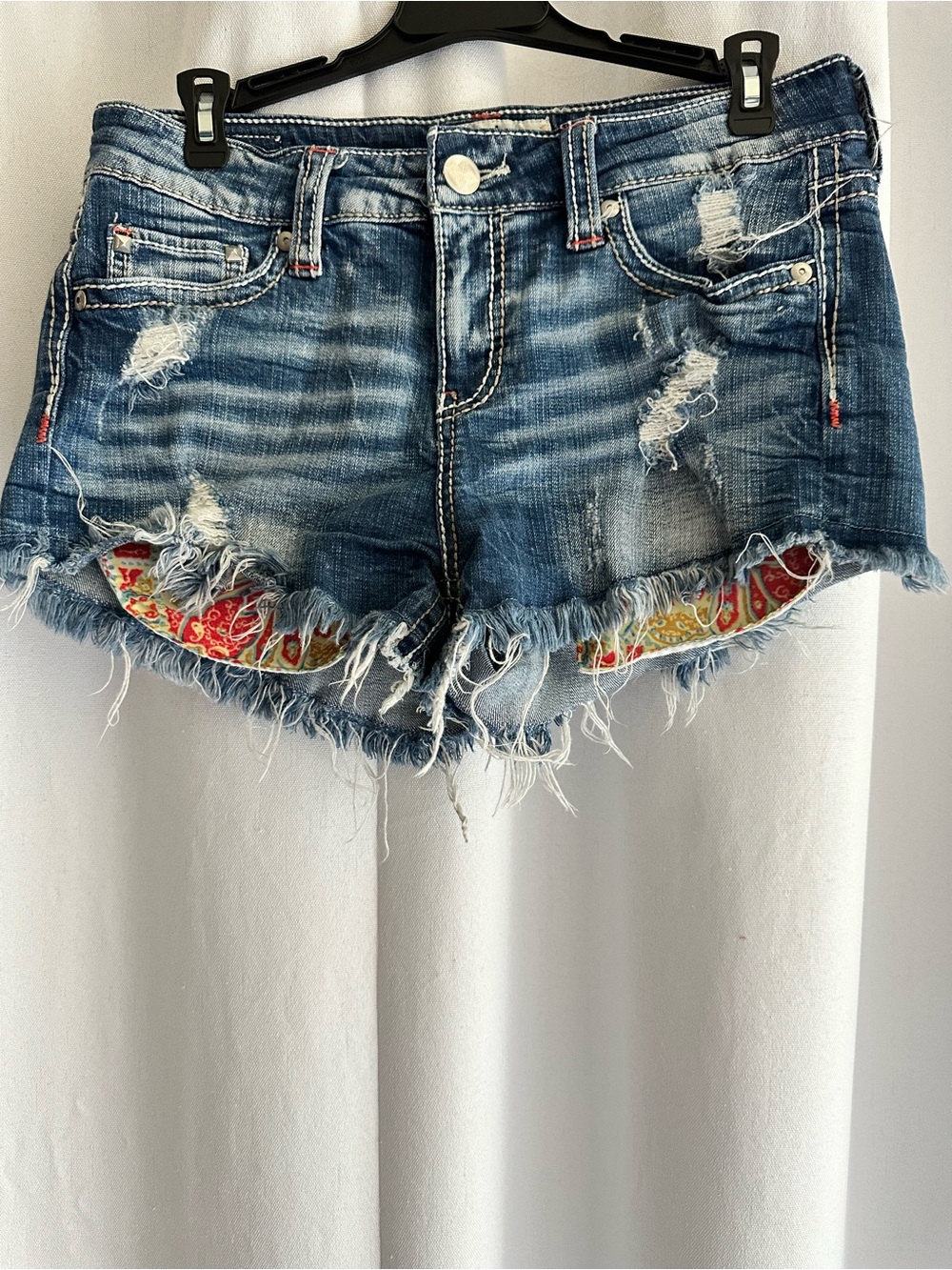 Daytrip Distressed Blue Denim Shorts with Paisley Accent